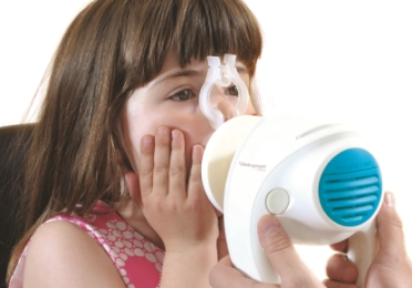 Girl using Tremoflo oscillometer