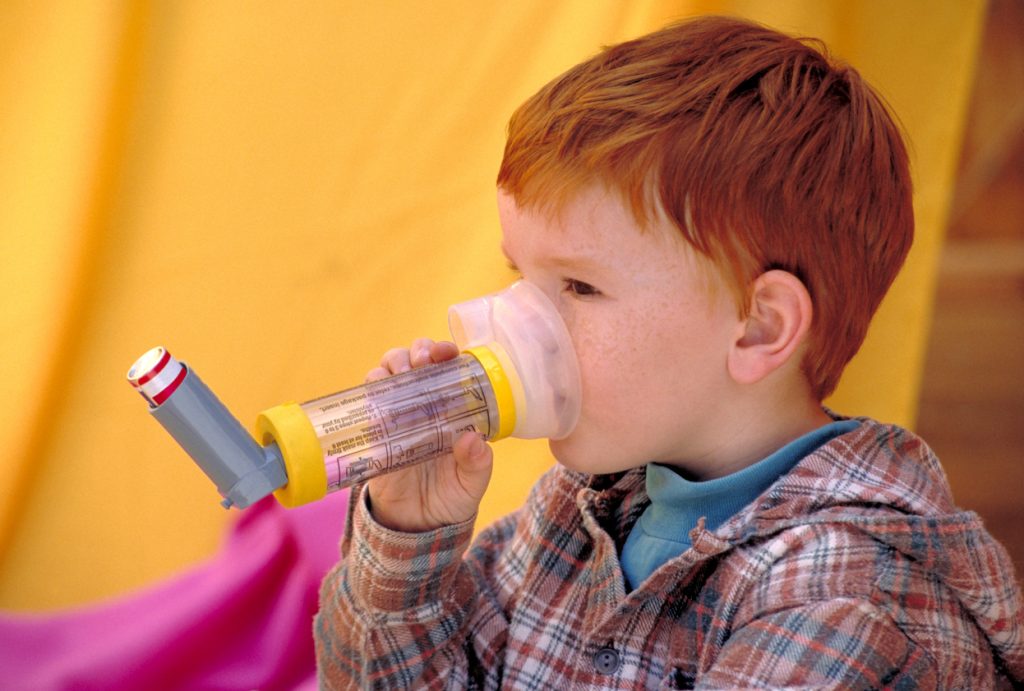 Child with asthma inhaler